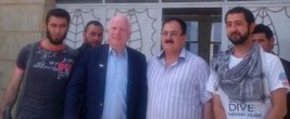 Senator John McCain with bearded jihadists. McCain entered Syria illegally to show support for the these terrorists.